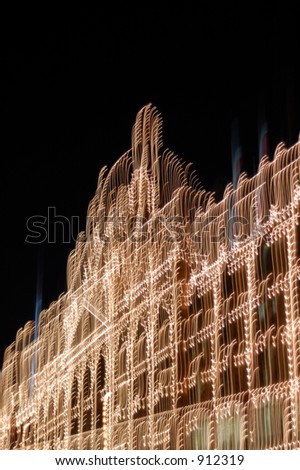 Harrods department store with motion blur at night, London.