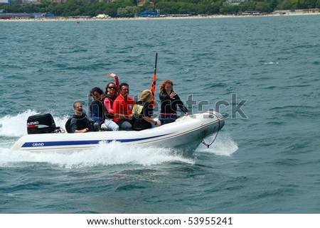 VARNA, BULGARIA - MAY 24: Speed boat is guiding the vessels at the Parade of sail during Tall Ship Regatta 2010 on May 24, 2010 in Varna, Bulgaria.