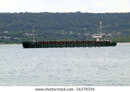 VARNA, BULGARIA - JULY 01: Cargo ship ORFEUS (Year Built: 1978, Flag: Cambodia, DeadWeight: 2851 t) is sailing away into open sea after a short stay in Port of Varna on July 01 2010 in Varna, Bulgaria.
