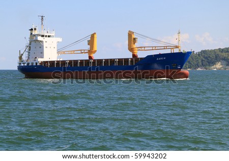 VARNA, BULGARIA - AUGUST 23: Cargo ship DARJA (Year Built: 1984, Flag: Belize, DeadWeight: 4145 t) sails into Port of Varna-West to be loaded with goods on August 23, 2010 in Varna, Bulgaria.