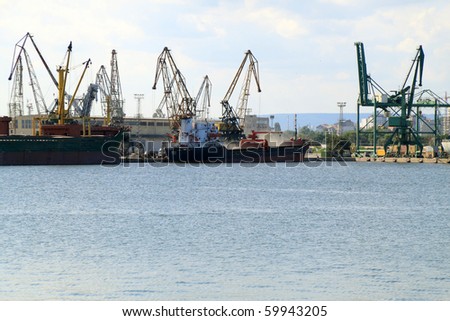 VARNA, BULGARIA - AUGUST 23: Cargo ship ARENA (Flag: Turkey, DeadWeight: 4390 t, Year Built: 1979, IMO: 7725568) moored in Port of Varna and loaded with barley on August 23, 2010 in Varna, Bulgaria.