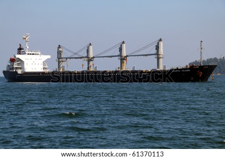 VARNA, BULGARIA - SEPTEMBER 19: Cargo ship LAUREL ISLAND (Year Built: 2005, Flag: Panama) sails into Port of Varna-West to deliver 17 790 tons of sugar on September 19, 2010 in Varna, Bulgaria.