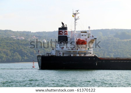 VARNA, BULGARIA - SEPTEMBER 19: Cargo ship LAUREL ISLAND (Year Built: 2005, Flag: Panama) sails into Port of Varna-West to deliver 17 790 tons of sugar on September 19, 2010 in Varna, Bulgaria.