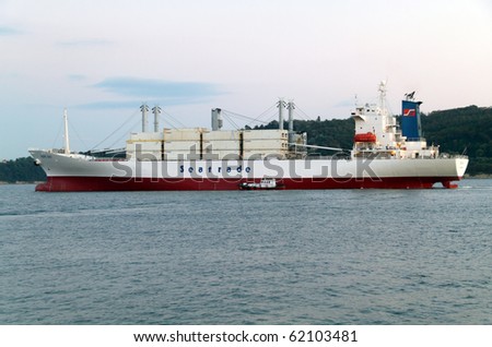VARNA, BULGARIA - SEPTEMBER 30: Cargo ship HOPE BAY (Year Built: 1996, Flag: Neth. Antilles) sails away into open sea. The ship was loaded with containers on September 30, 2010 in Varna, Bulgaria.