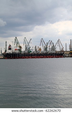 VARNA, BULGARIA - OCTOBER 03: Cargo ship LAUREL ISLAND (Year Built: 2005, Flag: Panama) is loaded with 9885 tones of sunflower seed in Port of Varna-East on October 03, 2010 in Varna, Bulgaria.