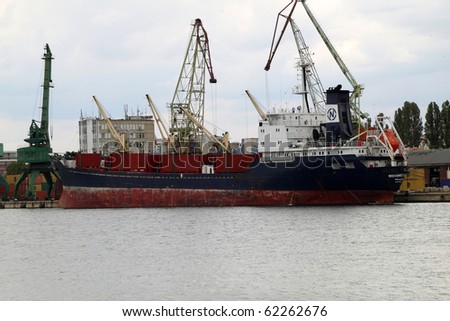 VARNA, BULGARIA - OCTOBER 03: Cargo ship MEHMET BEY (Year Built: 2000, Flag: St Kitts Nevis) is loaded with 4900 tones of sunflower seed in Port of Varna-East on October 03, 2010 in Varna, Bulgaria.