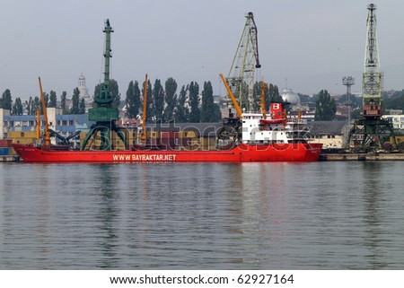 VARNA, BULGARIA - OCTOBER 12: Cargo ship AYHAN BAYRAKTAR (Year Built: 1986, Flag: Turkey) is loaded with 5200 tones of corn in Port of Varna-East on October 12, 2010 in Varna, Bulgaria.