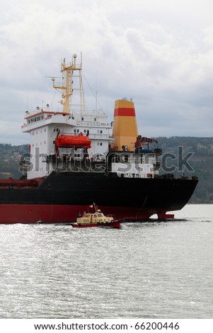 VARNA, BULGARIA - NOVEMBER 27: Cargo ship VOLA 1  (Year Built: 1992, Flag: Malta) sails into open sea after a major revamp work on November 27, 2010. Ship\'s destination is Port of Mariupol, Ukraine.
