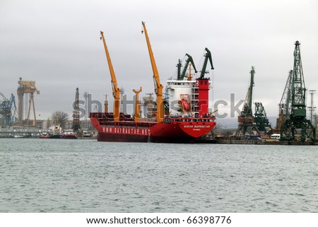 VARNA, BULGARIA - DECEMBER 01: Cargo ship BURAK BAYRAKTAR (Year Built: 2002, Flag: Turkey) is loaded with 10000 tones of corn in Port of Varna-East on December 01, 2010 in Varna, Bulgaria.