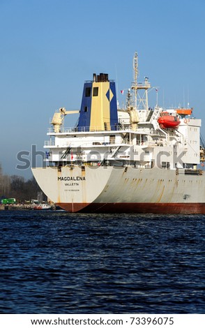 VARNA, BULGARIA - MARCH 14: Cargo ship MAGDALENA (Year Built: 1988, Dead Weight: 13864 t) is sailing away into open sea after a short stay in Varna-west port on March 14, 2011 in Varna, Bulgaria