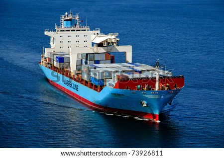 VARNA, BULGARIA-MAR 24: Cargo ship MAERSK TRAPANI (Year Built: 1990, Dead Weight: 21238 t) sails away into open sea after a short stay in Varna-west port on March 24, 2011 in Varna, Bulgaria