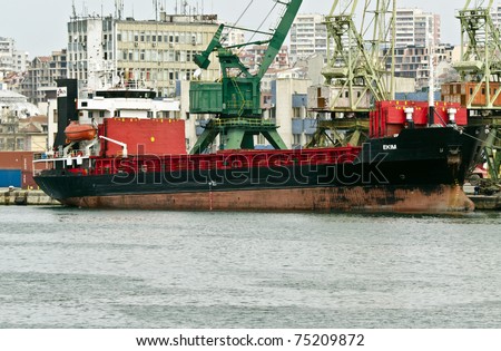 VARNA, BULGARIA - APR 08: Cargo ship EKIM (Year Built: 1979, Flag: Liberia) is loaded with sunflower seed in Port of Varna-East on April 08, 2011 in Varna, Bulgaria.