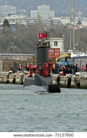 VARNA, BULGARIA - APR 08: Crew members stand on board the Turkish submarine DOLUNAY (S-352) on April 08, 2011 in Varna, Bulgaria. The vessel is taking part in Starfish 2011 Naval exercise.