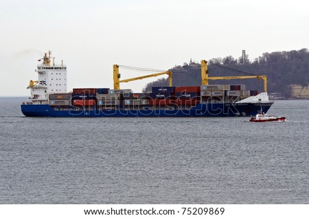 VARNA, BULGARIA - APR 08: Cargo ship CMA CGM MEKNES (Flag: Antigua Barbuda, IMO: 9435820) sails into Port of Varna-West to be loaded with containers on April 08, 2011 in Varna, Bulgaria.