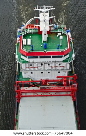 VARNA, BULGARIA - APR 19: Newly build cargo ship SELDENIZ (IMO: 9540601, Flag: Turkey) sails into open sea loaded with silica sand in bulk on April 19, 2011 in Varna, Bulgaria
