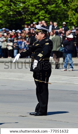 VARNA, BULGARIA - MAY 6: Lieutenant commander M. Trifonov is conducting the Official Navy marching band on May 6, 2011 in Varna, Bulgaria. May 6, is the Day of the Bulgarian Army.