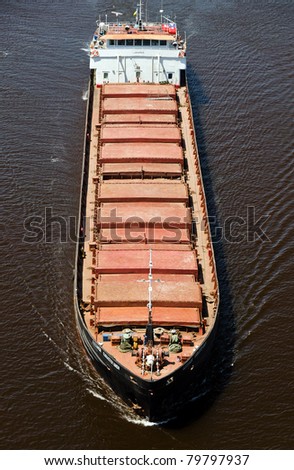 VARNA, BULGARIA - MAY 15: Cargo ship ALEXANDR KARASTOYANOV (Flag: Ukraine,  IMO: 8947618) sails into open sea loaded with 1700 t of metal scrap in bulk on May 15, 2011 in Varna, Bulgaria.