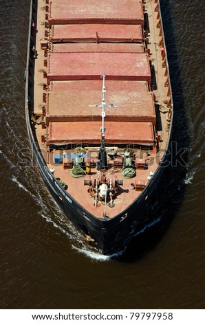 VARNA, BULGARIA - MAY 15: Cargo ship ALEXANDR KARASTOYANOV (Flag: Ukraine,  IMO: 8947618) sails into open sea loaded with 1700 t of metal scrap in bulk on May 15, 2011 in Varna, Bulgaria.