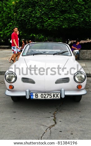 VARNA, BULGARIA - JUNE 25: The annual Retro rally “Old capitals” finished for the first time in town of Varna on June 25, 2011 in Varna, Bulgaria. White, convertible, unbranded retro car.