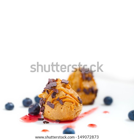 cakes with caramel and blueberries. Focus in front of cake