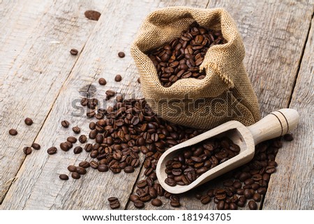 coffee bag on old wooden table and bag of coffee beans