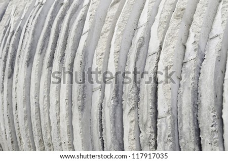 Industrial abstract: Cross section of round precast concrete forms on construction site