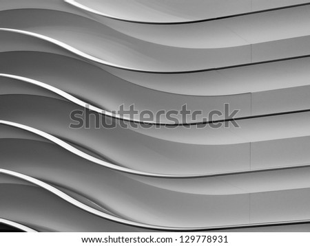 Abstract of interior design in black and white: Wavy wall at auto show in public convention center