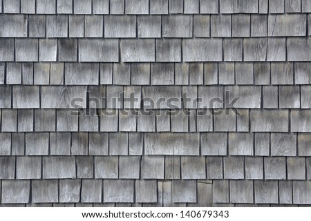 Siding of gray wood shingles with low environmental impact on house in Cape Cod, Massachusetts