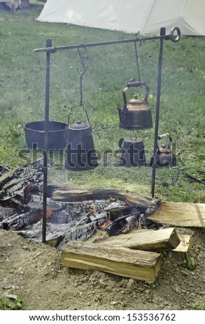 Smoky campfire in military encampment at reenactment of American Revolutionary War (1775-1783)