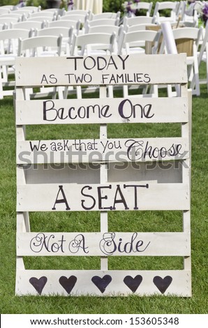 Sign at outdoor wedding: \