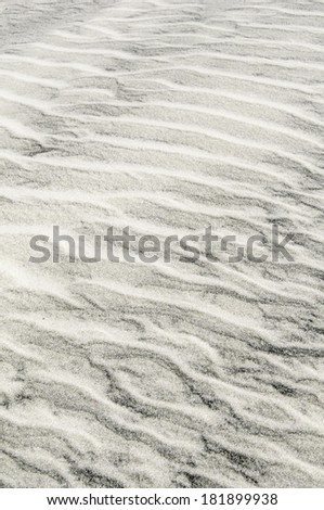 Background of light and dark beach sand: Rippled pattern created by the wind, St. Augustine, Florida, USA