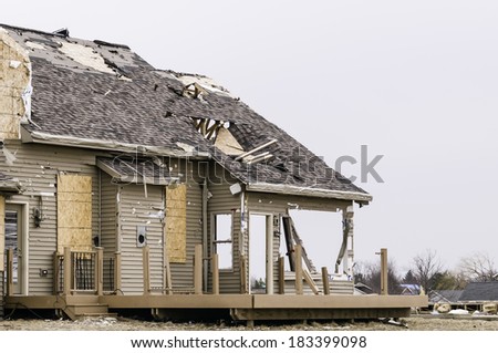 WASHINGTON, ILLINOIS, USA - MARCH 21, 2014: Corner of a single-family house hit by a tornado on November 17, 2013, that destroyed entire neighborhoods in the area.