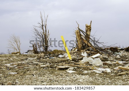 WASHINGTON, ILLINOIS, USA - MARCH 21, 2014: Four months after a tornado destroyed entire neighborhoods here, this blasted lot, strew with debris and long abandoned, still looks like ground zero.