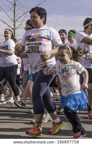 KALAMAZOO, MICHIGAN, USA - April 12, 2014: Runners start together on a 5K 