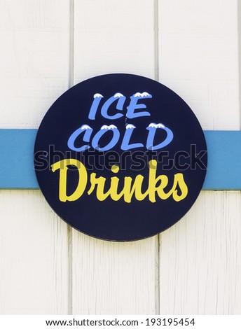 Refreshment sign on wall of concession stand on public beach