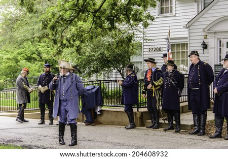 WAUCONDA, ILLINOIS/USA - JULY 12, 2014: An actor portraying Robert E. Lee, general of the Confederate Army, reminisces before a mock battle in a reenactment of the American Civil War (1861-1865).
