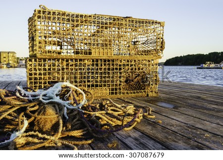 Lobster traps and pile of lines on a pier just after sunrise in Bar Harbor, Maine, USA (selective focus)