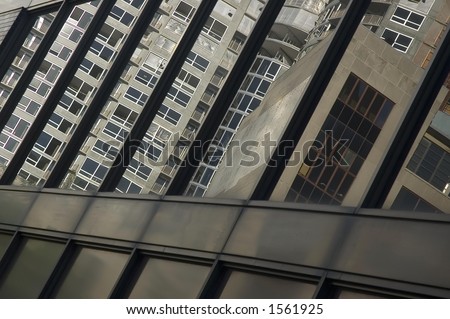 Condominiums and office building reflected by another office building