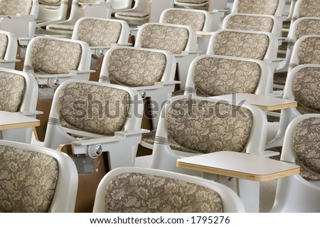 Padded backs of seats in college lecture hall