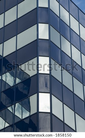 Section of reflective skyscraper in morning light