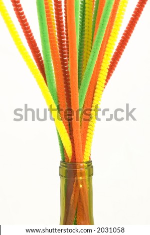 Bouquet of pipe cleaners in neck of wine bottle