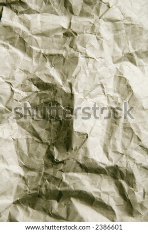Hidden face in wrinkled wrapping paper
