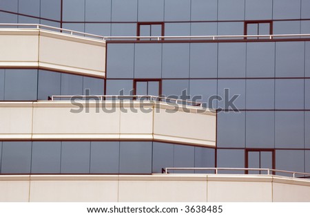 Contemporary office building with balconies, partial view