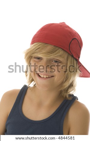 stock photo : Grinning Caucasian boy of ten with long blond hair wearing red 