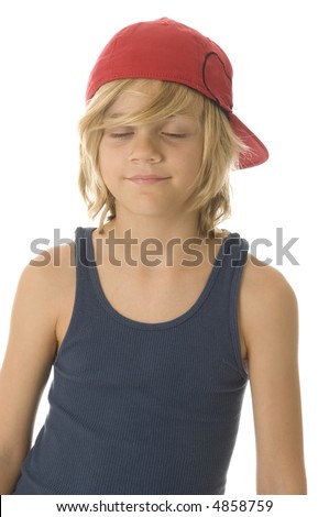 stock photo : Caucasian boy of ten with long blond hair and red baseball cap 
