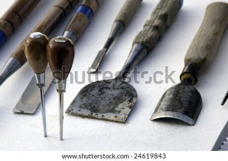 Hand tools of an ice sculptor (focus on handles of ice picks)