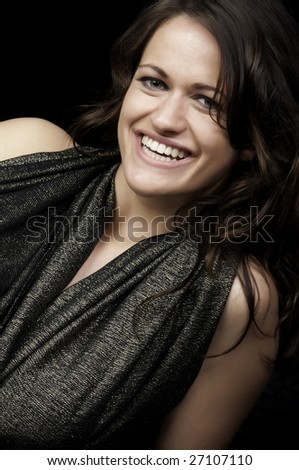 Smiling young brunette in sleeveless top