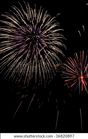 Two types of fireworks bursts, one larger than the other