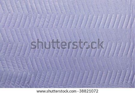 Blue padding with zigzag pattern on interior wall of elevator