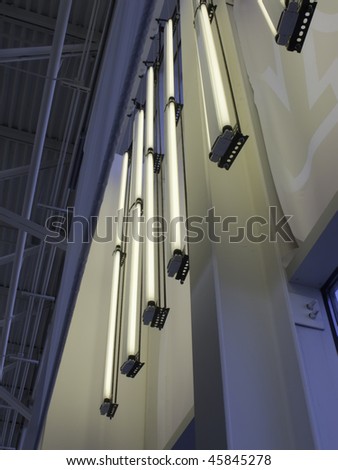 Fluorescent lights hung near ceiling of highway rest stop
